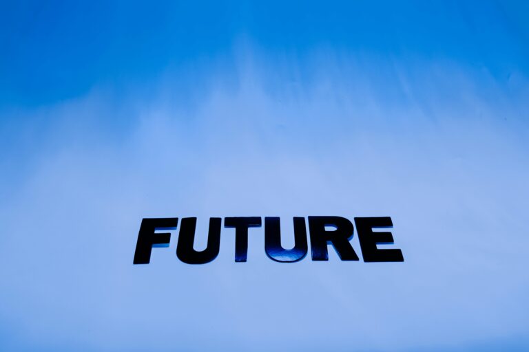 The word 'Future' in bold letters against a bright blue abstract background.